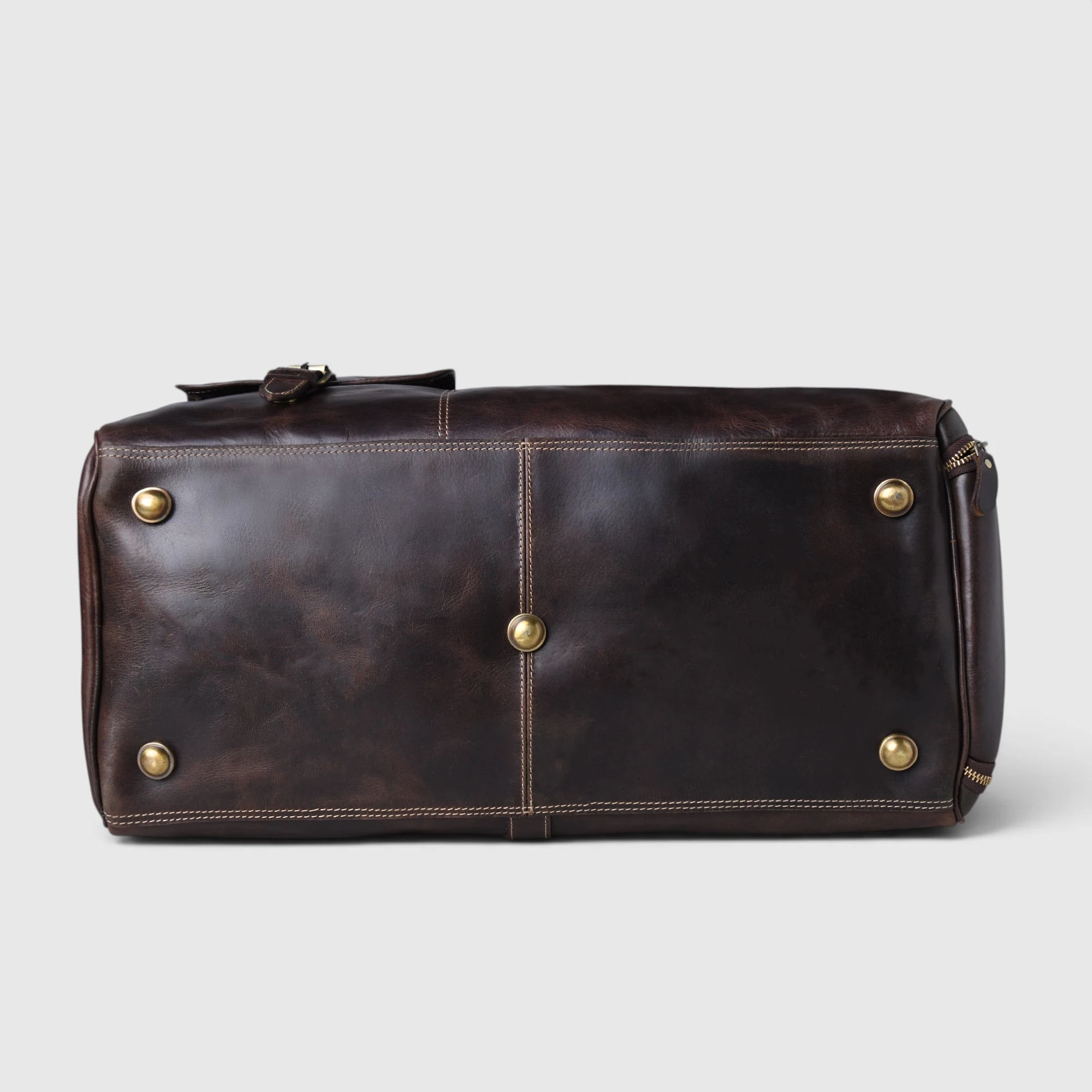 Bottom view of The Odyssey Leather Travel Duffle with brass studs