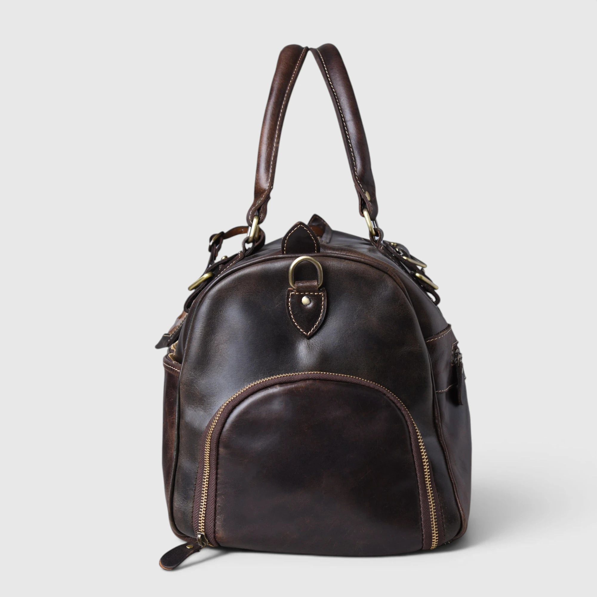Side profile view of The Odyssey Leather Travel Duffle in Espresso Brown