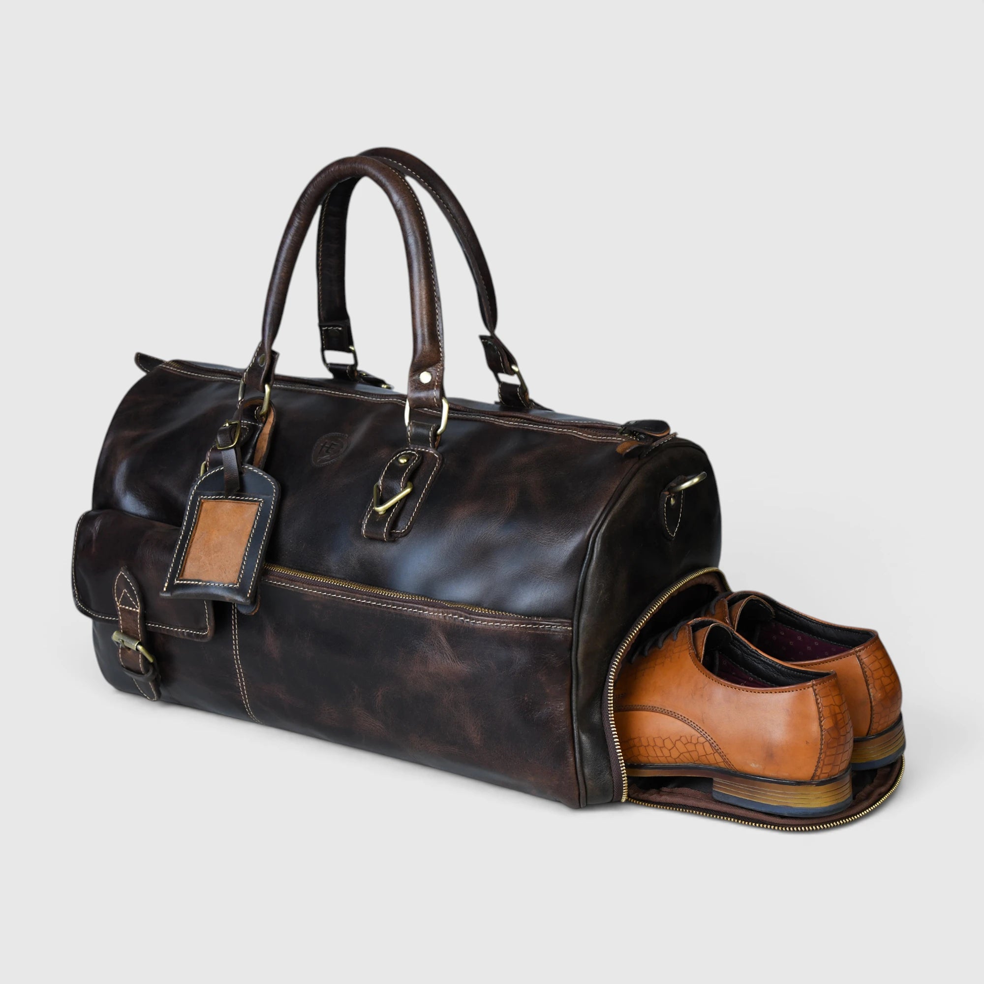 Side view of The Odyssey Leather Travel Duffle showing shoe compartment